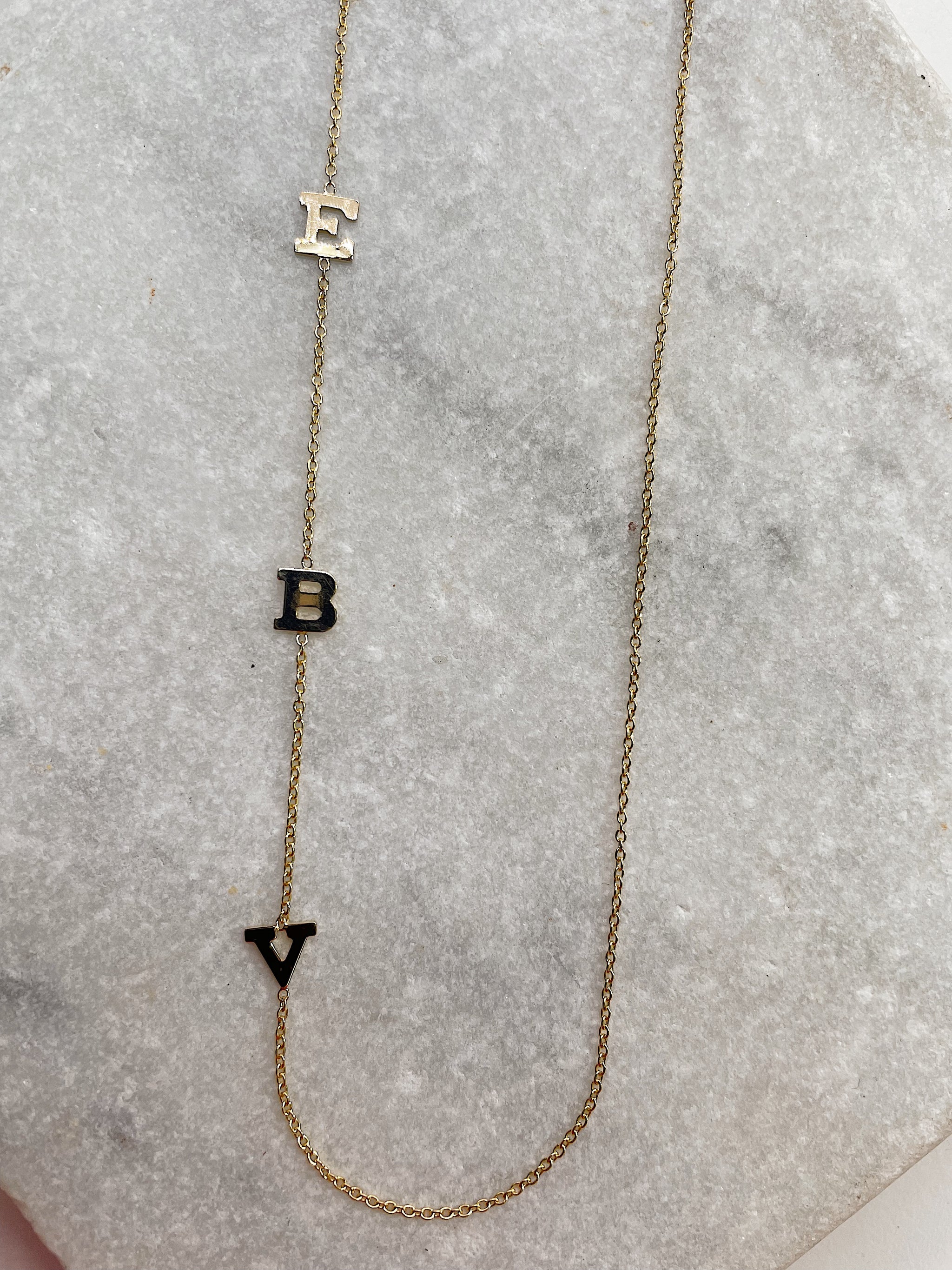 Gold asymmetrical initial necklace store